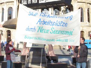 Banner der BüSo bei Bau-Demo